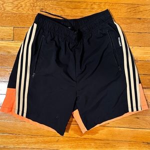 adidas Training color block shorts in black and orange